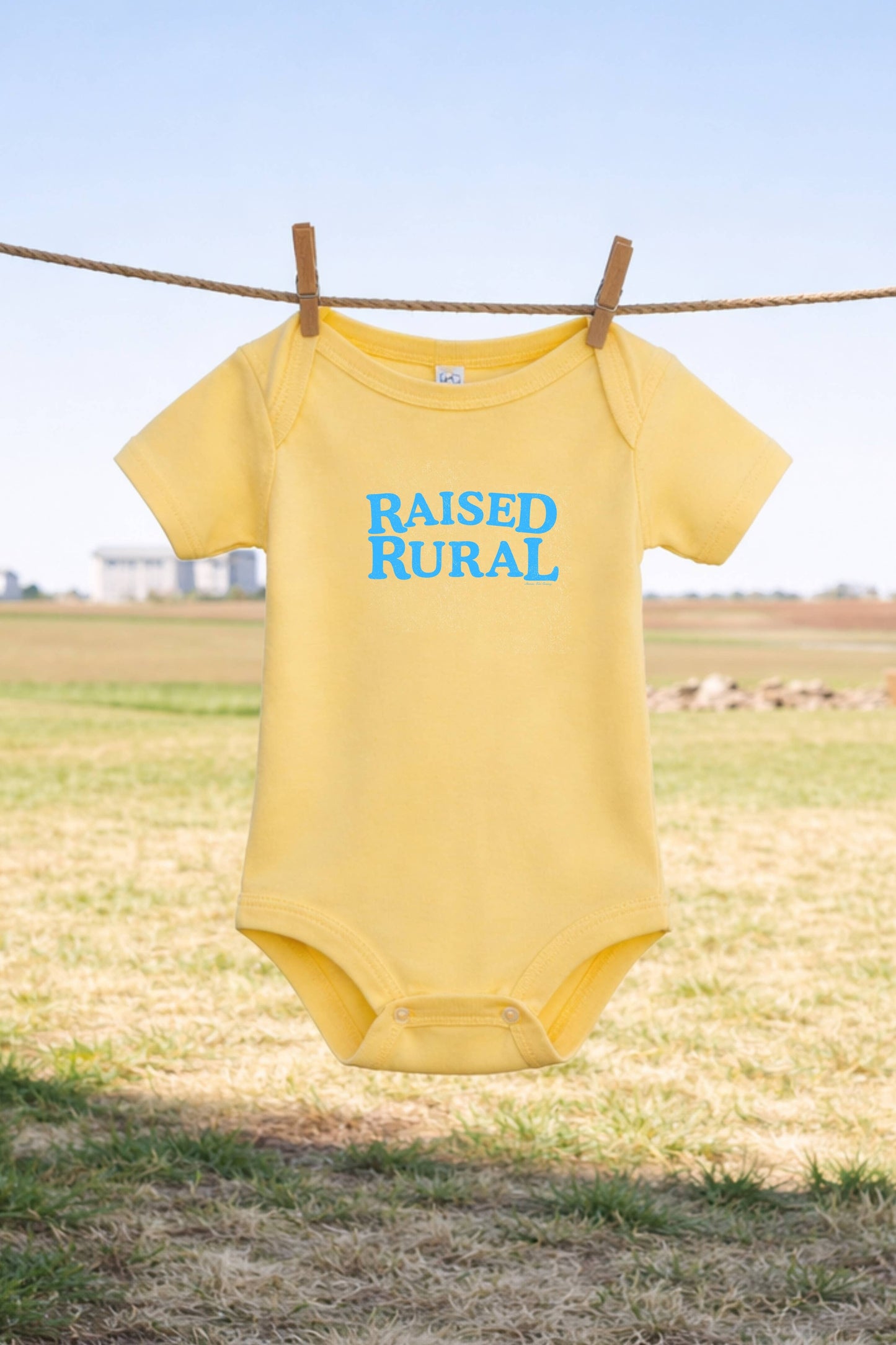 Western 'Raised Rural' Yellow Graphic Onesie: 12 MO Onesie